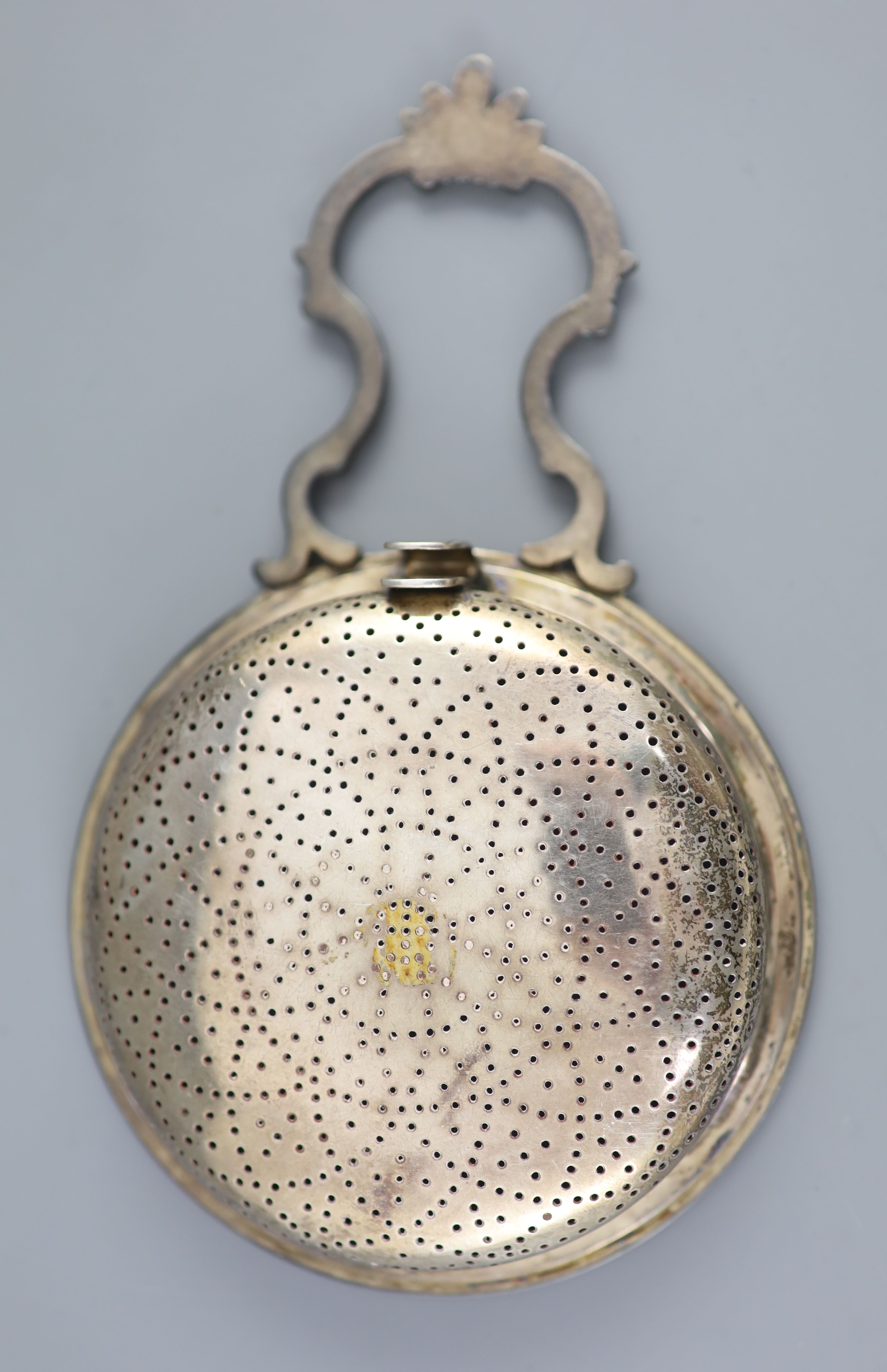 A George III silver single handled lemon strainer, London, 1779,